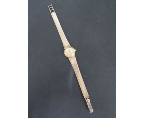 A 9ct gold Ladies Tissot stylist bracelet wristwatch, manual wind with baton dial - Width 18mm x Length 185mm - Total weight 