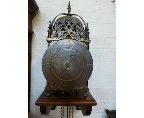 An 18th century style brass hook and spike lantern wall clock - the 17cm diameter signed Thos Moore, Ipswich - striking on a 