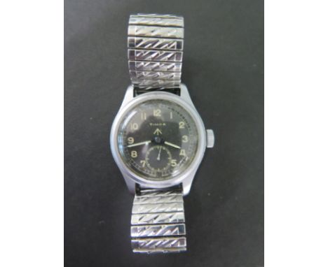 A Timor Military watch with black dial, Arabic numerals and secondary dial, manual wind - Width 40mm on a sprung strap
Condit