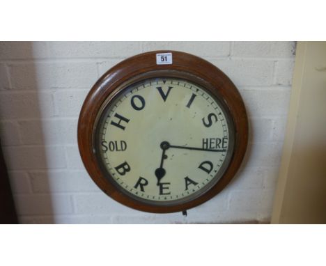 An oak cased advertising wall clock with a painted 12 inch dial HOVIS BREAD SOLD HERE movement needs attention not working 