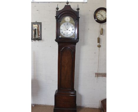 An 18th century oak and pine eight day striking longcase clock with a brass arched 12" dial and silvered chapter ring, calend
