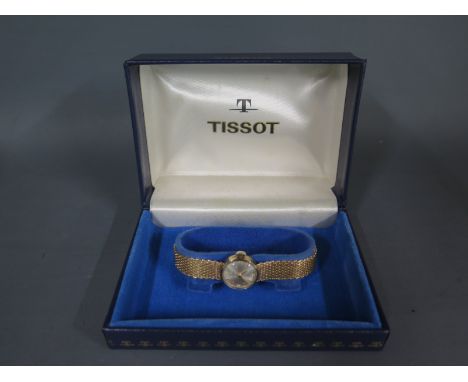 A 9ct yellow gold Tissot ladies bracelet watch manual wind working in clean condition, with box, total weight approx 19 grams