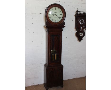 A 19th century mahogany eight day longcase clock with a painted 14" circular dial having secondary dial indistinctly signed a