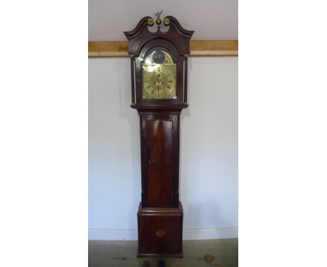 A mahogany 8 day striking longcase clock with 12 inch arched brass dial with rocking ship movement having pendulum and weight