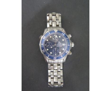 An Omega Seamaster chronometer wristwatch 300m titanium case, navy blue wave face, blue bezel, central second sweep, date win