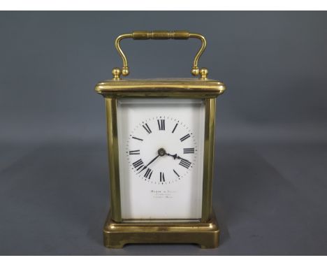 A brass cased carriage clock - the enamelled dial inscribed Wilson and Sharp Edinburgh - French maker with Roman numerals to 