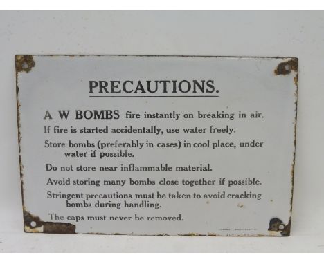 A rectangular Precautions enamel sign for A.W. Bombs, 12 x 8". 