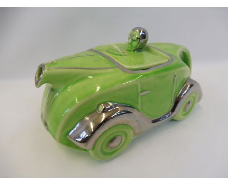 A 1930s green and silvered teapot in the form of a pre-war motorcar.