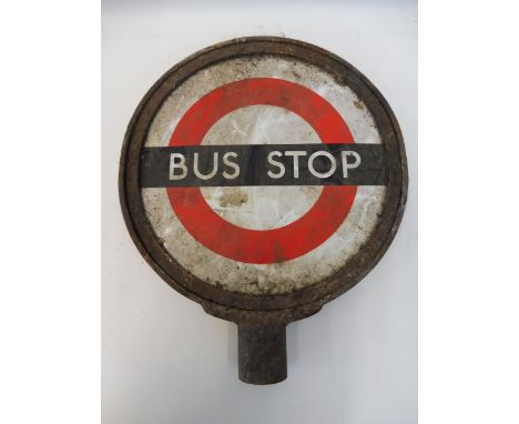 A pair of circular Bus Stop enamel signs mounted back to back within a metal frame, 13" diameter.