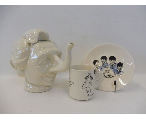 A 'Spitting Image' style white ceramic teapot in the form of Margaret Thatcher, also a Carlton Ware Prince Charles mug and a 