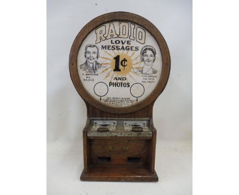 A rare and early slot machine titled Radio Love Messages, made by Exhibit Supply Company, circa 1930s, 12" wide x 19 1/4" hig