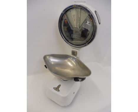 A large set of white enamel and mirrored Avery shopkeeper's scales.