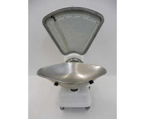 A set of white enamel Avery shopkeeper's scales.
