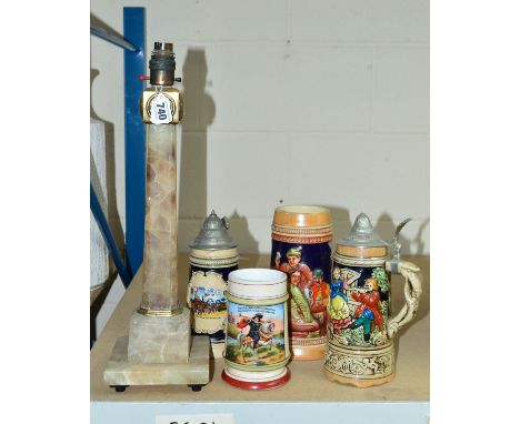 FOUR GERMAN BEER STEINS, two fitted with pewter lids, together with an onyx lamp in the shape of Cleopatra's needle, topped w