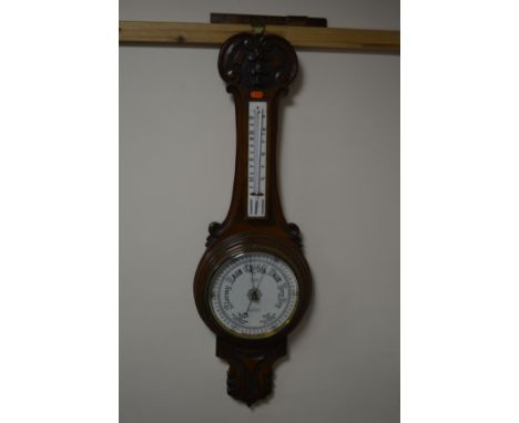 A 20TH CENTURY OAK ANEROID BAROMETER, marked F J Gould (sd)