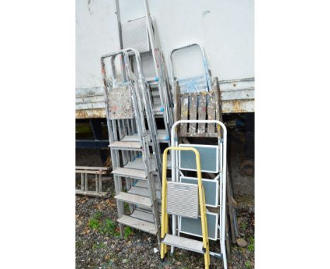 A QUANTITY OF STEP LADDERS, to include seven aluminium and one wooden (8)