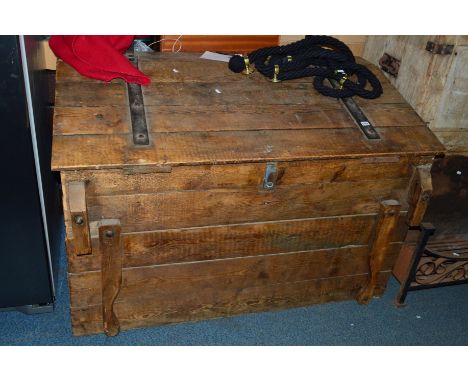 A VINTAGE PINE SLOPED TRUNK, with iron banded hinges and four pivetted  handles to each corners and two strap handles to top,