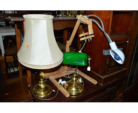 A BRASS DOMED DESK LAMP, a brass table lamp and another lamp (3)