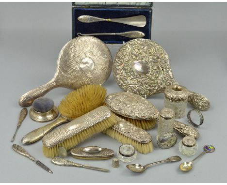 A PARCEL OF SILVER BACKED/HANDLED DRESSING TABLE REQUISITES, including hand mirrors, brushes, button hooks, nail buffer, etc,