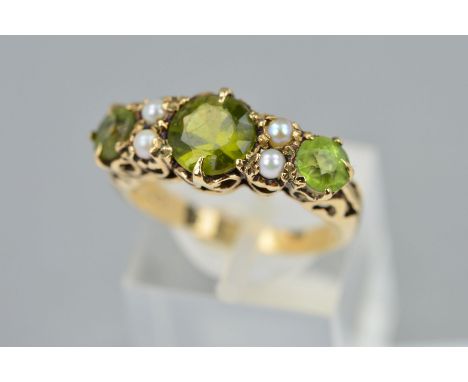 A LATE 20TH CENTURY PERIDOT AND SEED PEARL HALF HOOP RING, fancy scroll design sides and shoulders, ring size K, stamped 9ct,