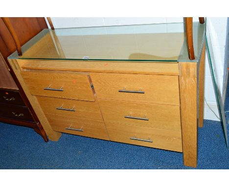 A LIGHT OAK SIDEBOARD, with glass top and six drawers, approximate size width 120cm x depth 45cm x height 81cm
