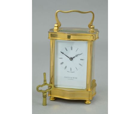 A MAPPIN AND WEBB BRASS CASED CARRIAGE CLOCK OF SERPENTINE FORM, enamel dial with Roman numerals, back plate engraved Made in