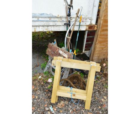 A WORK BENCH, various garden tools, towing rope and two tressel stands
