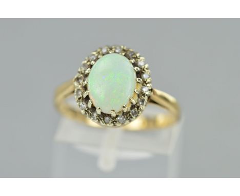 A 9CT OPAL AND DIAMOND CLUSTER RING, the central opal cabochon within a single cut diamond surround, hallmarked Birmingham 19