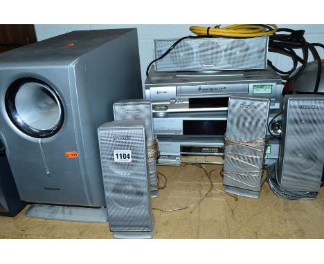 A PANASONIC SURROUND SOUND SYSTEM, with controller, a video player and a video DVD recorder
