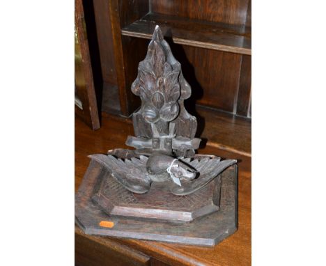 AN EARLY 20TH CENTURY CARVED OAK SHELF with an eagle, together with five oak reeded legs, etc (6)
