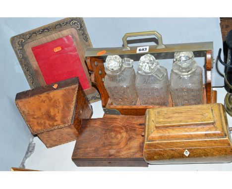 A THREE BOTTLED TANTALUS,  a tea caddy (missing interior) a stationery box (s.d), a photoframe (s.d) and another box (possibl