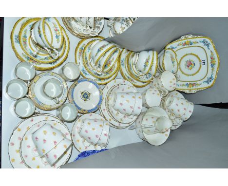 THREE TEA SETS, to include Aynsley decorated with roses over a white ground, Paragon with floral sprays below a yellow band a