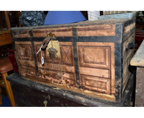 A VICTORIAN PINE METAL BOUNDED TRUNK, a Victorian pine blanket chest, a painted ammo crate, two suitcases and a commode chair