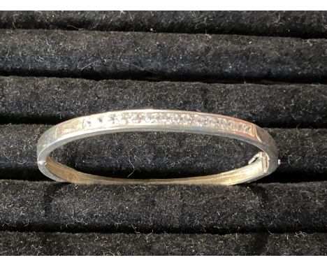 A 925 silver bangle with white stones 