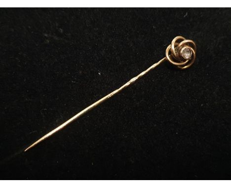 A hallmarked 14ct stick pin with a central diamond 1.45g 
