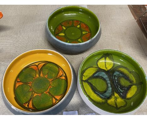 Three assorted Poole pottery bowls d17cm 