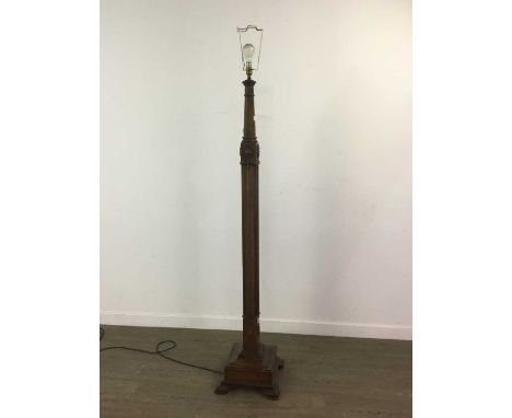 MAHOGANY STANDARD LAMP 20TH CENTURY with gadrooned sconce to ring turned tapered column, over shell moulding and quarter flut