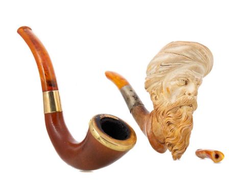 TWO VICTORIAN MEERSCHAUM PIPES LATE 19TH CENTURY one with bowl carved in the form of the head of a Turk, the other, plain wit