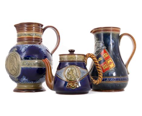 ROYAL DOULTON, TWO LAMBETH STONEWARE JUGS & A TEAPOT CIRCA 1900 the first jug inscribed IN COMMEMORATION OF THE HOISTING OF T