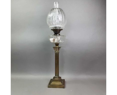 VICTORIAN OIL LAMP LATE 19TH CENTURY with clear glass chimney and reservoir, the shade etched with scrolling foliage, over fl