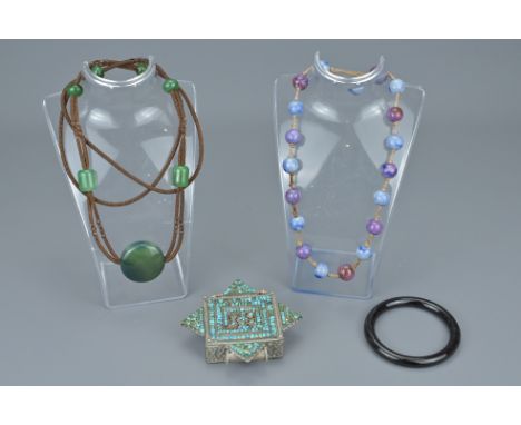 A Collection Of Jewellery Items. Including Tibetan Prayer Box, Jade Necklace, Jade Bangle And Pottery Junyao Type Beads. Bang