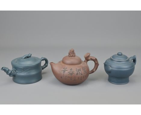 A Chinese Yixing Pottery Teapot With Two Others. Teapot Diameter 15Cm