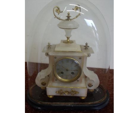 Late 19th C gilt metal and alabaster mantel clock with striking movement marked 121, on oval ebonised base with glass dome (o