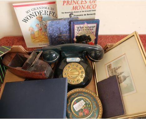 Vintage woodworking plane, various books, framed coloured prints of Saint Paul's Cathedral, telephone, various world coinage 