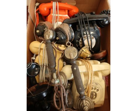 Selection of various vintage telephones and early telephone handsets, vintage light switches, oil lamp tops etc. 