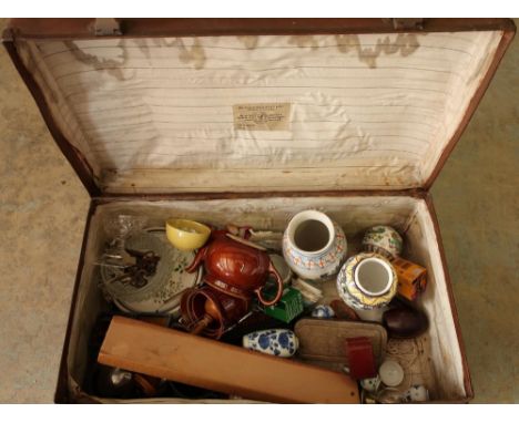 Vintage suitcase containing a selection of various decorative ceramics, glassware, carved wood items, vintage razor and other