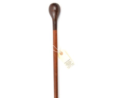 A Zulu walking stick, polished brown wood haft slightly tapered towards the lower end, 2 tone darkwood ovoid grip, 36½” overa