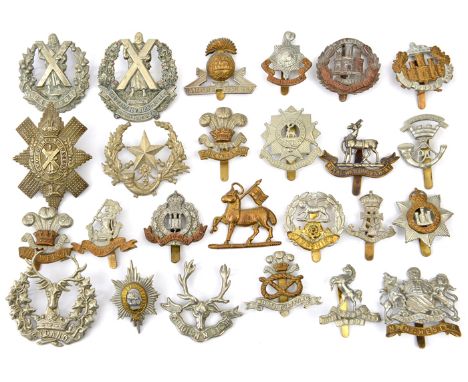 25 different infantry cap/glengarry badges, including Devon, Suffolk, Beds & Herts, Lancs Fus, Cameronians WM, Hampshire, Wel