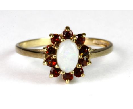 A 9ct yellow gold opal and garnet cluster ring  (P.5).