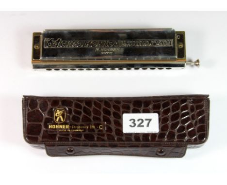 A vintage Hohner chromatic harmonica.